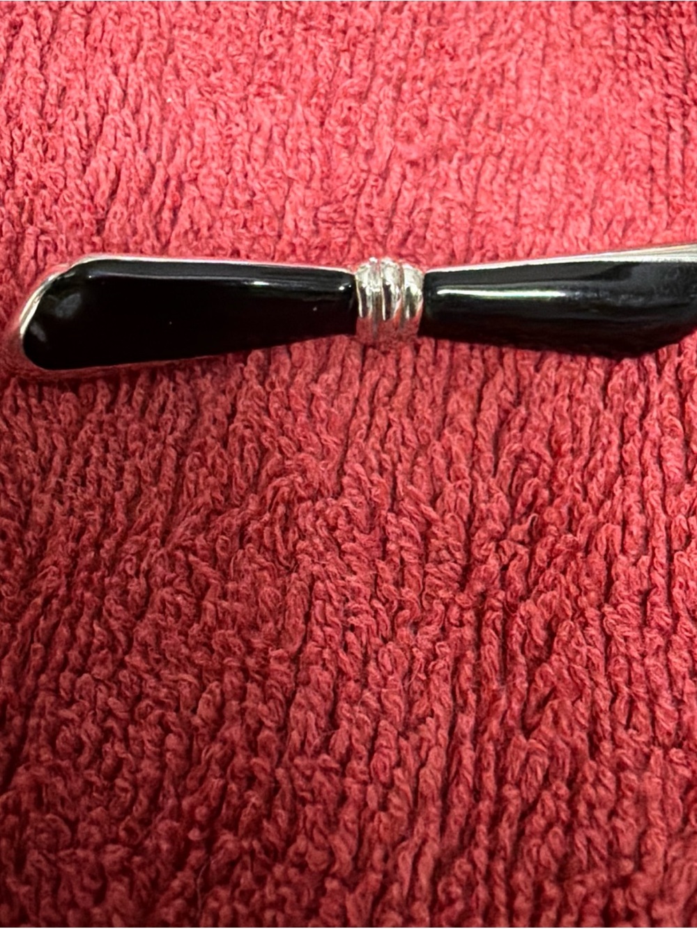 Monet Black enamel brooch signed slim looking bow 2 tone